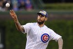 CHICAGO, IL - MAY 08: WWE Champion CM Punk throws out the first pitch before the Chicago Cubs versus the Atlanta Braves game on May 8, 2012 at Wrigley Field in Chicago, Illinois.  (Photo by David Banks/Getty Images)