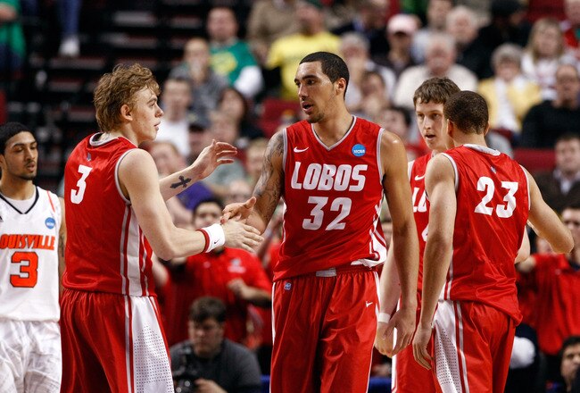 PORTLAND, OR - MARCH 17:  Drew Gordon #32 of the New Mexico Lobos celebrates with teammate Hugh Greenwood #3 in the second half against the Louisville Cardinals during the third round of the 2012 NCAA Men's Basketball Tournament at the Rose Garden Arena on March 17, 2012 in Portland, Oregon.  (Photo by Jonathan Ferrey/Getty Images)