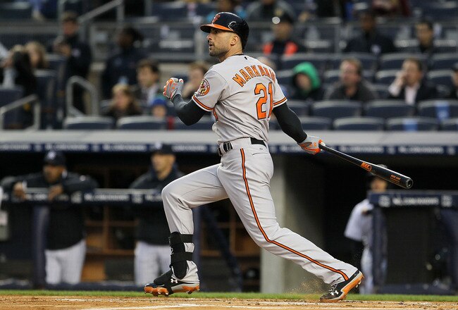 NEW YORK, NY - MAY 02:  Nick Markakis #21 of the Baltimore Orioles doubles in the first inning against the New York Yankees at Yankee Stadium on May 2, 2012  in the Bronx borough of New York City.  (Photo by Jim McIsaac/Getty Images)