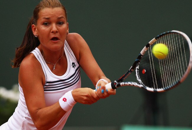 PARIS, FRANCE - MAY 30:  Agnieszka Radwanska of Poland plays a backhand during her women's singles second round match against Venus Williams of USA during day four of the French Open at Roland Garros on May 30, 2012 in Paris, France.  (Photo by Clive Brunskill/Getty Images)