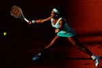PARIS, FRANCE - MAY 29:  Serena Williams of USA plays a forehand in her women's singles first round match between Serena Williams of USA and Virginie Razzano of France during day three of the French Open at Roland Garros on May 29, 2012 in Paris, France.  (Photo by Mike Hewitt/Getty Images)