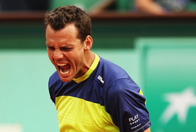 PARIS, FRANCE - MAY 31:  Paul-Henri Mathieu of France celebrates a point in his men's singles second round match against John Isner of USA during day 5 of the French Open at Roland Garros on May 31, 2012 in Paris, France.  (Photo by Matthew Stockman/Getty Images)