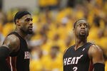 INDIANAPOLIS, IN - MAY 24:  LeBron James #6 and  Dwyane Wade #3 of the Miami Heat wait during a time-out against the Indiana Pacers in Game Six of the Eastern Conference Semifinals in the 2012 NBA Playoffs at Bankers Life Fieldhouse on May 24, 2012 in Indianapolis, Indiana. The Heat defeated the Pacers 105-93 to win the series. NOTE TO USER: User expressly acknowledges and agrees that, by downloading and/or using this photograph, User is consenting to the terms and conditions of the Getty Images License Agreement.  (Photo by Jonathan Daniel/Getty Images)