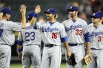 PHOENIX, AZ - MAY 21:  Andre Ethier #16 of the Los Angeles Dodgers high fives teammates after defeating the Arizona Diamondbacks in the MLB game at Chase Field on May 21, 2012 in Phoenix, Arizona. The Dodgers defeated the Diamondbacks 6-1. (Photo by Christian Petersen/Getty Images)