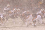 CHICAGO - DECEMBER 12: The wind swirls snow as Tom Brady #12 of the New England Patriots calls the signals against the Chicago Bearsat Soldier Field on December 12, 2010 in Chicago, Illinois. (Photo by Jonathan Daniel/Getty Images)
