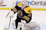 BOSTON, MA - MARCH 29:  Tim Thomas #30 of the Boston Bruins stops a shot by the Washington Capitals on March 29, 2012 at TD Garden in Boston, Massachusetts.  (Photo by Elsa/Getty Images)