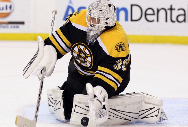 BOSTON, MA - MARCH 29:  Tim Thomas #30 of the Boston Bruins stops a shot by the Washington Capitals on March 29, 2012 at TD Garden in Boston, Massachusetts.  (Photo by Elsa/Getty Images)