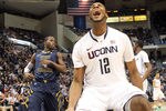 HARTFORD, CT - JANUARY 9:  Andre Drummond #12 of the Connecticut Huskies reacts after scoring despite the defense of Jabarie Hinds #4 of the West Virginia Mountaineers at the XL Center on January 9, 2012 in Hartford, Connecticut.  (Photo by Jim Rogash/Getty Images)