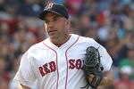 BOSTON, MA - MAY 28: Scott Atchison #48 of the Boston Red Sox leaves the field after the eighth inning against the Detroit Tigers at Fenway Park May 28, 2012  in Boston, Massachusetts. (Photo by Jim Rogash/Getty Images)