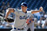 SAN DIEGO, CA - MAY 16:  Chris Capuano #35 of the Los Angeles Dodgers pitches during the first inning of a baseball game against the San Diego Padres at Petco Park on May 16, 2012 in San Diego, California. (Photo by Denis Poroy/Getty Images)
