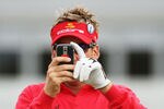TURNBERRY, SCOTLAND - JULY 14:  Ian Poulter of England takes a picture with his mobile phone during a practice round prior to the 138th Open Championship on July 14, 2009 on the Ailsa Course, Turnberry Golf Club, Turnberry, Scotland.  (Photo by Andrew Redington/Getty Images)