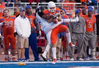 BOISE, ID - NOVEMBER 12: Matt Miller #2 of the Boise State Broncos fails to come up with the ball against Jason Verrett #2 of the TCU Horned Frogs at Bronco Stadium on November 12, 2011 in Boise, Idaho.  Verrett was called for holding. (Photo by Otto Kitsinger III/Getty Images)