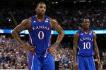 NEW ORLEANS, LA - APRIL 02:  Thomas Robinson #0 and Tyshawn Taylor #10 of the Kansas Jayhawks look on in the first half while taking on the Kentucky Wildcats in the National Championship Game of the 2012 NCAA Division I Men's Basketball Tournament at the Mercedes-Benz Superdome on April 2, 2012 in New Orleans, Louisiana.  (Photo by Jeff Gross/Getty Images)