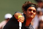PARIS, FRANCE - MAY 30:  Roger Federer of Switzerland serves during his men's singles second round match against Adrian Ungur of Romania during day four of the French Open at Roland Garros on May 30, 2012 in Paris, France.  (Photo by Clive Brunskill/Getty Images)