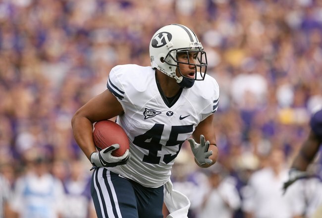 SEATTLE - SEPTEMBER 6:  Harvey Unga #45 of the BYU Cougars runs with the ball during their game against the Washington Huskies on September 6, 2008 at Husky Stadium in Seattle, Washington. The Cougars defeated the Huskies 28-27. (Photo by Otto Greule Jr/Getty Images)
