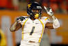 MIAMI GARDENS, FL - JANUARY 04:  Tavon Austin #1 of the West Virginia Mountaineers celebrates after he scored an 8-yard rushing touchdown in the first quarter against the Clemson Tigers during the Discover Orange Bowl at Sun Life Stadium on January 4, 2012 in Miami Gardens, Florida.  (Photo by Streeter Lecka/Getty Images)