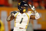 MIAMI GARDENS, FL - JANUARY 04:  Tavon Austin #1 of the West Virginia Mountaineers celebrates after he scored an 8-yard rushing touchdown in the first quarter against the Clemson Tigers during the Discover Orange Bowl at Sun Life Stadium on January 4, 2012 in Miami Gardens, Florida.  (Photo by Streeter Lecka/Getty Images)