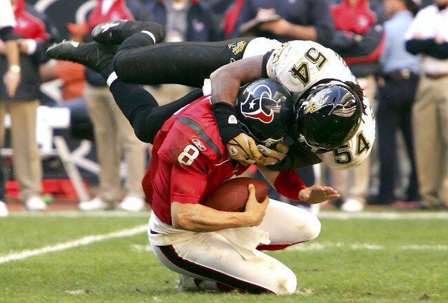 HOUSTON - DECEMBER 24:  Mike Peterson #54 of the Jacksonville Jaguars sacks quarterback David Carr #8 of the Houston Texans on December 24, 2005 at Reliant Stadium in Houston, Texas. The Jaguars won 38-20.  (Photo by Lisa Blumenfeld/Getty Images)