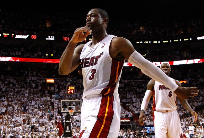 MIAMI, FL - MAY 30:  Dwayne Wade #3 and LeBron James #23 of the Miami Heat react against the Boston Celtics in Game Two of the Eastern Conference Finals in the 2012 NBA Playoffs on May 30, 2012 at American Airlines Arena in Miami, Florida. NOTE TO USER: User expressly acknowledges and agrees that, by downloading and or using this photograph, User is consenting to the terms and conditions of the Getty Images License Agreement.  (Photo by Mike Ehrmann/Getty Images)