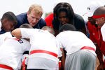 NEW ORLEANS - SEPTEMBER 08:  U.S. first lady Michelle Obama and NFL commissioner Roger Goodell  listen to their team in the huddle during the NFL�s Play 60 campaign to fight childhood obesity at Brock Elementary School September 8, 2010 in New Orleans, Louisiana. Obama joined NFL Commissioner Roger Goodell and former NFL coach Tony Dungy to promote the Play 60 campaign and the NFL's newest efforts to support Let's Move! (Photo by Chris Graythen/Getty Images)