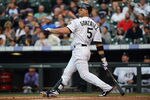 DENVER, CO - MAY 31:  Carlos Gonzalez #5 of the Colorado Rockies watches his three run homerun off of starting pitcher Bud Norris #20 of the Houston Astros in the first inning at Coors Field on May 31, 2012 in Denver, Colorado.  (Photo by Doug Pensinger/Getty Images)