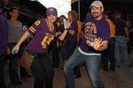 NEW ORLEANS, LA - JANUARY 08:  Louisiana State University Tigers fans dance in the French Quarter on January 8, 2012 in New Orleans, Louisiana.  LSU and Alabama will play in the BCS National Championship on January 9th.  (Photo by Ronald Martinez/Getty Images)