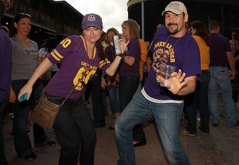 NEW ORLEANS, LA - JANUARY 08:  Louisiana State University Tigers fans dance in the French Quarter on January 8, 2012 in New Orleans, Louisiana.  LSU and Alabama will play in the BCS National Championship on January 9th.  (Photo by Ronald Martinez/Getty Images)