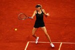 PARIS, FRANCE - JUNE 01:  Maria Sharapova of Russia plays a forehand in her women's singles second round match against Ayumi Morita of Japan during day 6 of the French Open at Roland Garros on June 1, 2012 in Paris, France.  (Photo by Clive Brunskill/Getty Images)