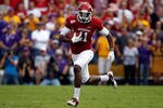 BATON ROUGE, LA - NOVEMBER 25:  Wide receiver Cobi Hamilton #11 of the Arkansas Razorbacks runs after a catch for 15-yards in the first quarter against the LSU Tigers at Tiger Stadium on November 25, 2011 in Baton Rouge, Louisiana.  (Photo by Chris Graythen/Getty Images)