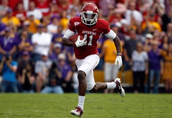 BATON ROUGE, LA - NOVEMBER 25:  Wide receiver Cobi Hamilton #11 of the Arkansas Razorbacks runs after a catch for 15-yards in the first quarter against the LSU Tigers at Tiger Stadium on November 25, 2011 in Baton Rouge, Louisiana.  (Photo by Chris Graythen/Getty Images)