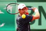 PARIS, FRANCE - MAY 31:  Andy Murray of Great Britain plays a backhand during his men's singles second round match against Jarkko Nieminen of Finland during day five of the French Open at Roland Garros on May 31, 2012 in Paris, France.  (Photo by Matthew Stockman/Getty Images)