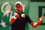 PARIS, FRANCE - MAY 30:  Novak Djokovic of Serbia plays a forehand in his men's singles second round match against Blaz Kavcic of Slovenia during day 4 of the French Open at Roland Garros on May 30, 2012 in Paris, France.  (Photo by Clive Brunskill/Getty Images)