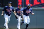 MINNEAPOLIS, MN - MAY 30: (L-R) Josh Willingham #16, Ben Revere #11 and Denard Span #2 of the Minnesota Twins celebrate a win against the Oakland Athletics on May 30, 2012 at Target Field in Minneapolis, Minnesota. The Twins defeated the Athletics 4-0. (Photo by Hannah Foslien/Getty Images)