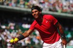 PARIS, FRANCE - MAY 29:  Rafael Nadal of Spain collects some balls on in his men's singles first round match against Simone Bolelli of Italy during day 3 of the French Open at Roland Garros on May 29, 2012 in Paris, France.  (Photo by Mike Hewitt/Getty Images)