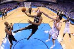 OKLAHOMA CITY, OK - MAY 31:  Kawhi Leonard #2 of the San Antonio Spurs goes up for a layup against Nick Collison #4 of the Oklahoma City Thunder in Game Five of the Western Conference Finals of the 2012 NBA Playoffs at Chesapeake Energy Arena on May 31, 2012 in Oklahoma City, Oklahoma. NOTE TO USER: User expressly acknowledges and agrees that, by downloading and or using this photograph, User is consenting to the terms and conditions of the Getty Images License Agreement.  (Photo by Ronald Martinez/Getty Images)