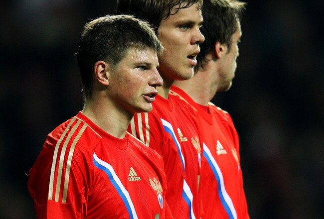 COPENHAGEN, DENMARK - FEBRUARY 29:  Andrey Arshavin (L) of Russia looks on in the wall during the International Friendly between Denmark and Russia at Parken Stadium on February 29, 2012 in Copenhagen, Denmark.  (Photo by Dean Mouhtaropoulos/Getty Images)