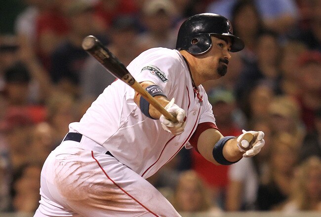 BOSTON, MA - MAY 30:  Adrian Gonzalez #28 of the Boston Red Sox doubles to knock in the go-ahead run in the seventh ining against the Detroit Tigers at Fenway Park May 30, 2012  in Boston, Massachusetts. (Photo by Jim Rogash/Getty Images)