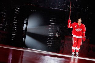 DETROIT, MI - OCTOBER 07:  Nicklas Lidstrom #5 of the Detroit Red Wings is is introduced prior to playing the Ottawa Senators at Joe Louis Arena on October 7, 2011 in Detroit, Michigan. Detroit won the game 5-3. (Photo by Gregory Shamus/Getty Images)
