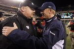 PHILADELPHIA, PA - JANUARY 02: Head coach Andy Reid of the Philadelphia Eagles meets with head coach Jason Garrett of the Dallas Cowboys after their game on January 2, 2011 at Lincoln Financial Field in Philadelphia, Pennsylvania. The Cowboys defeated the Eagles 14-13.  (Photo by Jim McIsaac/Getty Images)