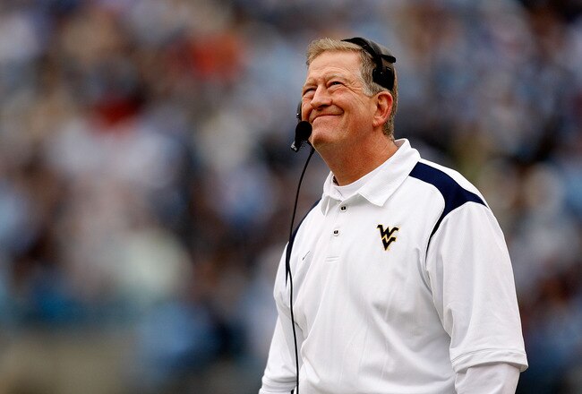 CHARLOTTE, NC - DECEMBER 27:  Head coach Bill Stewart of the West Virginia Mountaineers looks at the scoreboard during their game against the North Carolina Tar Heels at Bank of America Stadium on December 27, 2008 in Charlotte, North Carolina.  (Photo by Streeter Lecka/Getty Images)