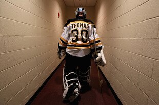GLENDALE, AZ - DECEMBER 28:  Goaltender Tim Thomas #30 of the Boston Bruins walks back to the locker room before the NHL game against the Phoenix Coyotes at Jobing.com Arena on December 28, 2011 in Glendale, Arizona.  (Photo by Christian Petersen/Getty Images)