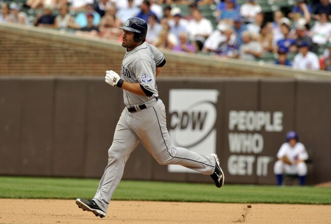 CHICAGO, IL - MAY 29: Carlos Quentin #18 of the San Diego Padres hits a solo home run in the fifth inning against the Chicago Cubs on May 29, 2012 at Wrigley Field in Chicago, Illinois.  (Photo by David Banks/Getty Images)