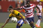 LANDOVER, MD - MAY 30: Hulk #20 of Brazil and Maurice Edu #7 of USA go after the ball during an International friendly game at FedExField on May 30, 2012 in Landover, Maryland.  (Photo by Rob Carr/Getty Images)