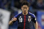 TOYOTA, JAPAN - FEBRUARY 29:  (EDITORIAL USE ONLY) Shinji Kagawa of Japan controls the ball during the 2014 FIFA World Cup Brazil Asian 3rd Qualifier match between Japan and Uzbekistan at Toyota Stadium on February 29, 2012 in Toyota, Japan.  (Photo by Kiyoshi Ota/Getty Images)