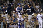 LOS ANGELES, CA - MAY 31:  Aramis Ramirez #16 of the Milwaukee Brewers is greeted at home plate by Nyjer Morgan #2 after both score on Ramirez' two run home run in the third inning against the Los Angeles Dodgers on May 31, 2012 at Dodger Stadium in Los Angeles, California.  (Photo by Stephen Dunn/Getty Images)