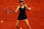 PARIS, FRANCE - JUNE 01:  Maria Sharapova of Russia plays a forehand in her women's singles second round match against Ayumi Morita of Japan during day 6 of the French Open at Roland Garros on June 1, 2012 in Paris, France.  (Photo by Clive Brunskill/Getty Images)