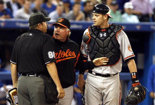 TORONTO, CANADA - MAY 29:  Buck Showalter (Manager) and Matt Wieters #32 of the Baltimore Orioles argue a strike call with Umpire Doug Eddings during MLB action against the Toronto Blue Jays at The Rogers Centre May 29, 2012 in Toronto, Ontario, Canada.  (Photo by Abelimages/Getty Images)
