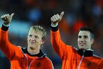 ROTTERDAM, NETHERLANDS - OCTOBER 07: Robin van Persie (R) and Dirk Kuyt of the Netherlands greet fans prior to the start of the UEFA EURO 2012 Group E Qualifier between Netherlands and Moldova at the Kuip stadium on October 7, 2011 in Rotterdam, Netherlands.  (Photo by Jasper Juinen/Getty Images)