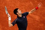 PARIS, FRANCE - JUNE 01:  Novak Djokovic of Serbia serves during his men's singles third round match against Nicolas Devilder of France during day six of the French Open at Roland Garros on June 1, 2012 in Paris, France.  (Photo by Matthew Stockman/Getty Images)