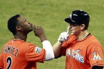 MIAMI, FL - MAY 28:  Hanley Ramirez #2 and Logan Morrison #5 of the Florida Marlins celebrate Morrison's two run home run against the Washington Nationals at Marlins Park on May 28, 2012 in Miami, Florida. The Marlins defeated the Nationals 5-3. (Photo by Marc Serota/Getty Images)